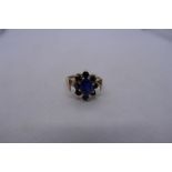 9ct yellow gold sapphire cluster ring in the form of a flower head, size P, marked 375, 3.3g