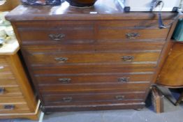 A late Victorian walnut chest having two short & three long drawers