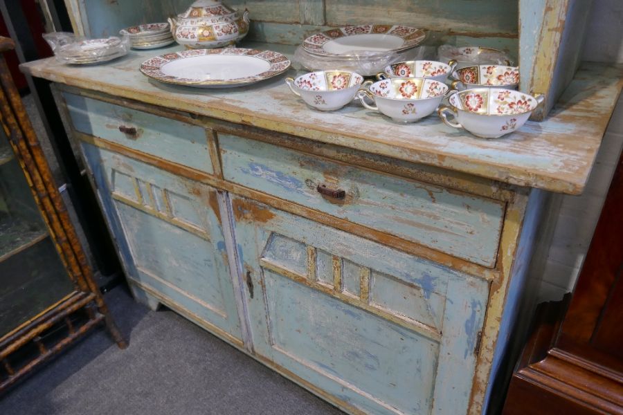 An old pine kitchen dresser having distressed paintwork, the top having glazed doors, 141.5cm - Image 3 of 3