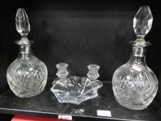 Two similar decanters, a Baccarat glass bowl and a pair of Baccarat squat candlesticks