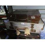 An iron and wood bound canvas trunk case, well labelled, plus 5 others of various materials includin