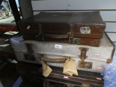 An iron and wood bound canvas trunk case, well labelled, plus 5 others of various materials includin