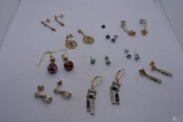 Collection 9ct and yellow metal stud and drop earrings, including ruby, emerald and moonstone exampl