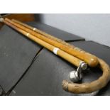 A malacca cane having silver knob and two other sticks