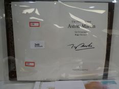 An Aston Martin hardback book by Oxford Press signed by Tony Brooks
