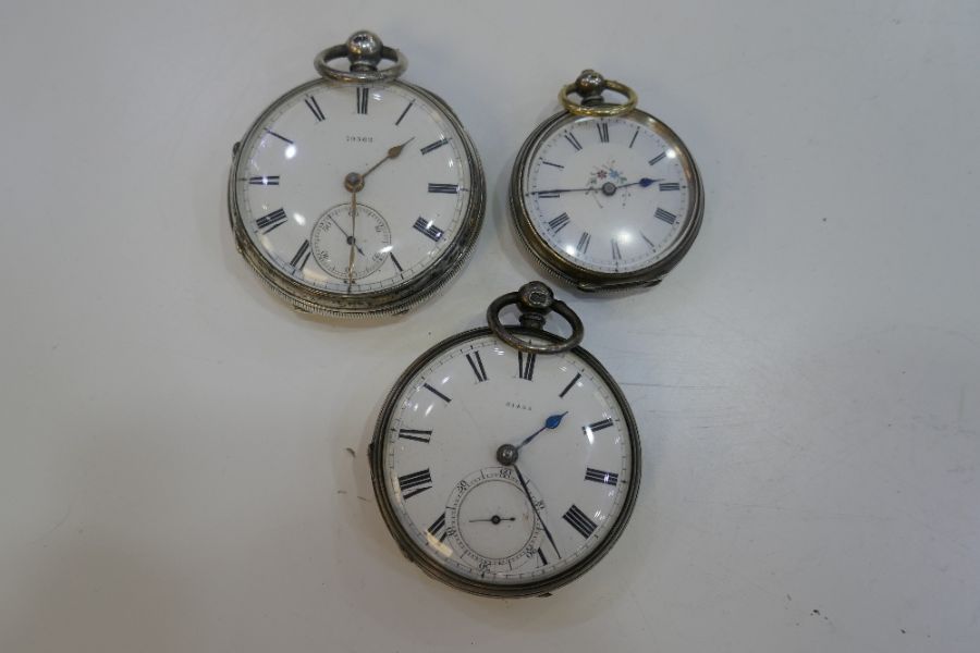 Three silver half hunter pocket watches, one hallmarked London 1861. David Cork, Victorian, another