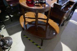 Large oval mahogany coffee table and smaller similar example