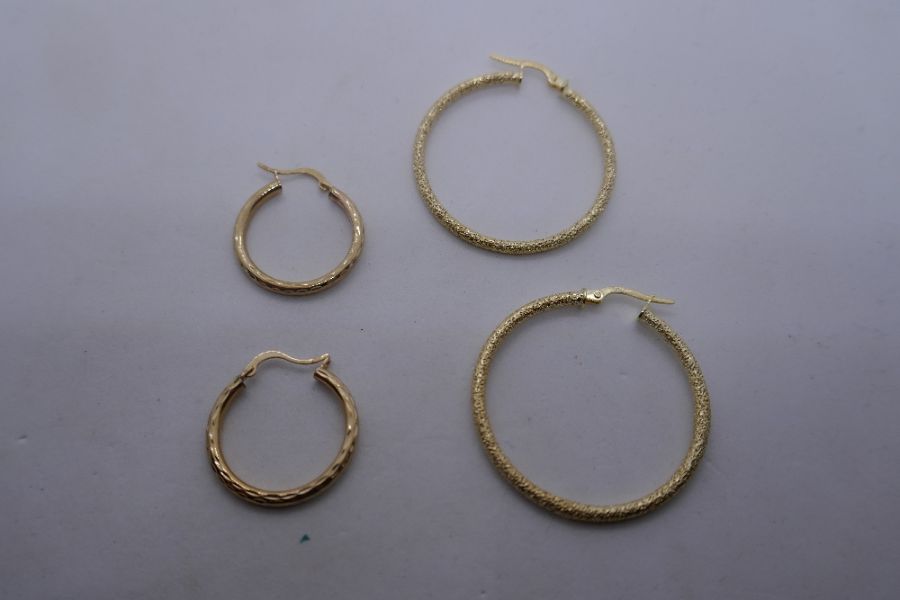 Two pairs of 9ct yellow gold hoop earrings, both marked 375, the largest pair 3cm diameter - Image 2 of 2