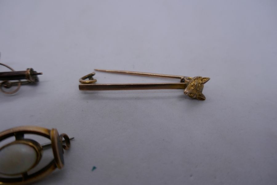 2 9ct bar brooches, one with fox head decoration and a small yellow metal example, 8.1g gross approx