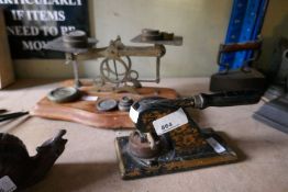 A vintage Post Office scales with brass weights and vintage stamp seal