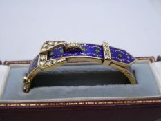 Late 20th Century, 14ct yellow gold buckle bangle with blue enameled detail inset with 11 brilliant