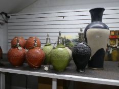 A quantity of Moroccan style lamps and vases