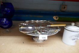 A silver plate cake stand and a small selection of knives and forks