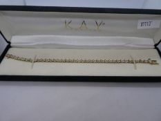 Pretty boxed 10K yellow and white illusion diamond set tennis bracelet, approx 19cm, 10K marked with