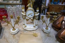 A 19th century French white marble and gilt decorated clock garniture