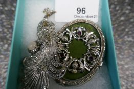 Large oval Celtic design brooch and silver and marcasite peacock brooch