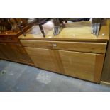 A modern oak sideboard having two drawers and cupboards below