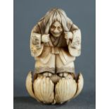 Ivory netsuke of a witch.