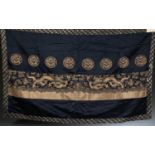 Chinese black and gold embroidered textile.