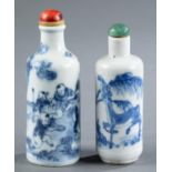 2 White and blue porcelain snuff bottles.