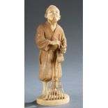 Ivory Okimono of an old man with a rake