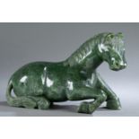 Chinese jade sculpture of a reclining horse.
