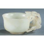 Chinese white carved jade libation cup, 19th c.