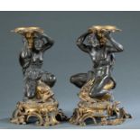 Pair of Bronze figural candle holders, 19th c.