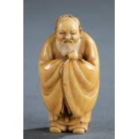 Ivory netsuke of an old man with peach.