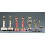 3 Pairs of stone and bronze candlesticks.