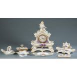 KPM porcelain rocaille dresser set and clock