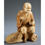 Ivory Okimono of a sitting and drinking man