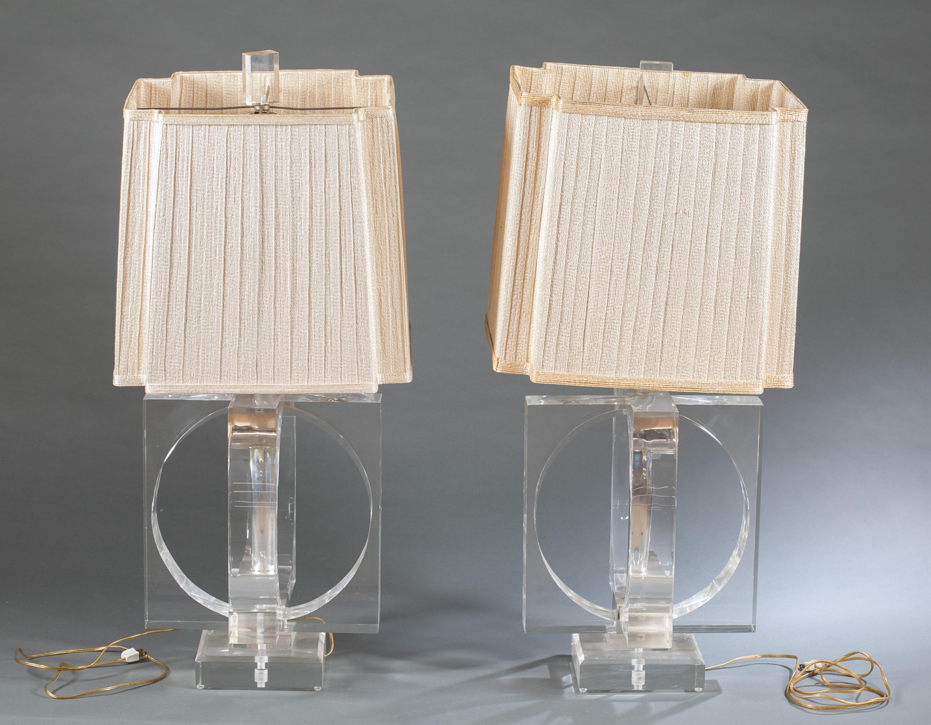 Pair of Modernist Lucite acrylic lamps.