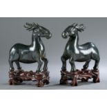 2 Chinese spinach jade deer with stands, 20th c.