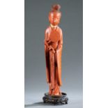 Red carved wood female figure.