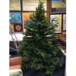 A boxed 6ft artificial Christmas tree on stand.