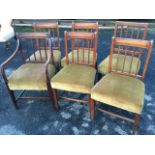 A married set of six nineteenth century dining chairs, all with moulded spindles to backs above