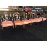 A set of six nineteenth century Hepplewhite style mahogany dining chairs with two carvers, the