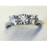 An 18ct white gold diamond ring, the three claw-set brilliant cut diamonds weighing over one-and-a-