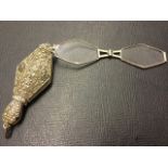 A Sterling silver lorgnette, with sprung folding hexagonal lenses in lozenge shaped case set with