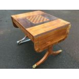 A walnut sofa games table, the rectangular rosewood crossbanded top with drop leaves having