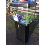 A Fishpod bowfronted glass aquarium, the tank on cupboard stand complete with instruction