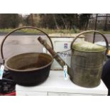 A galvanised watering can with domed cover and angled spout; a brass jam pan with rolled rim