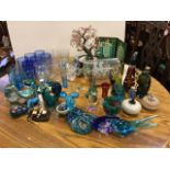 A miscellaneous collection of blue glass ornaments, scent bottles, a ship in a bottle, an oriental