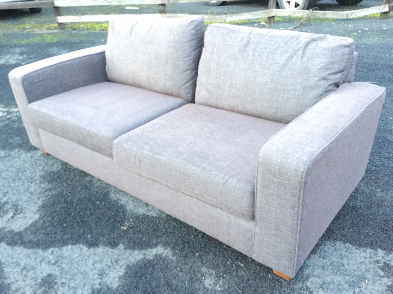 A contemporary upholstered Marks & Sparks sofa with loose cushions and rectangular platform arms,