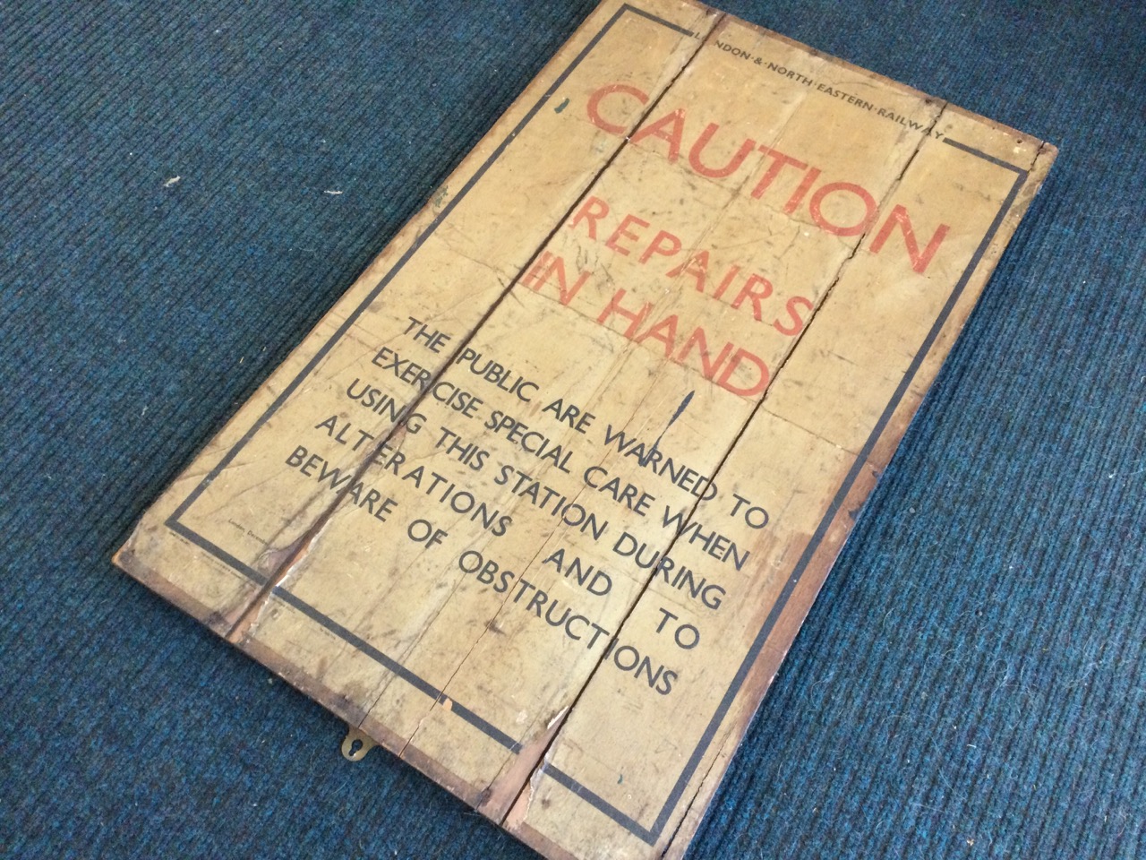 A LNER repairs warning poster, printed in black & red, the paper pasted down on tongue & groove