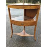 A Georgian mahogany bowfronted boxwood strung corner washstand, the rising top inlaid with fleur-