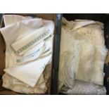 Two boxes of linen including embroidery, damask tablecloths, lace, crewelwork, table mats,