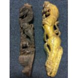 An ancient painted carved wood mount in the form of a stylised lion with supporting leaves; and