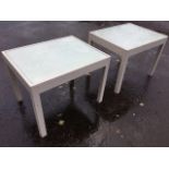 A pair of painted coffee tables with plate glass tops on square chamfered column legs. (30in x